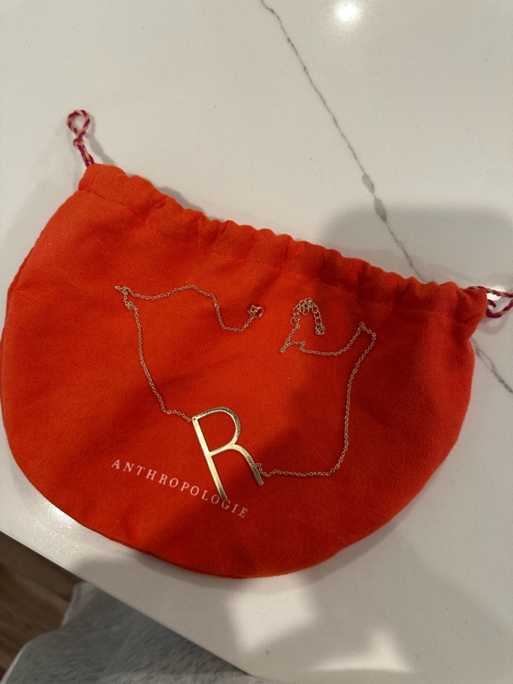 Anthropologie “R” necklace w/ Orange Drawstring Jewelry Pouch